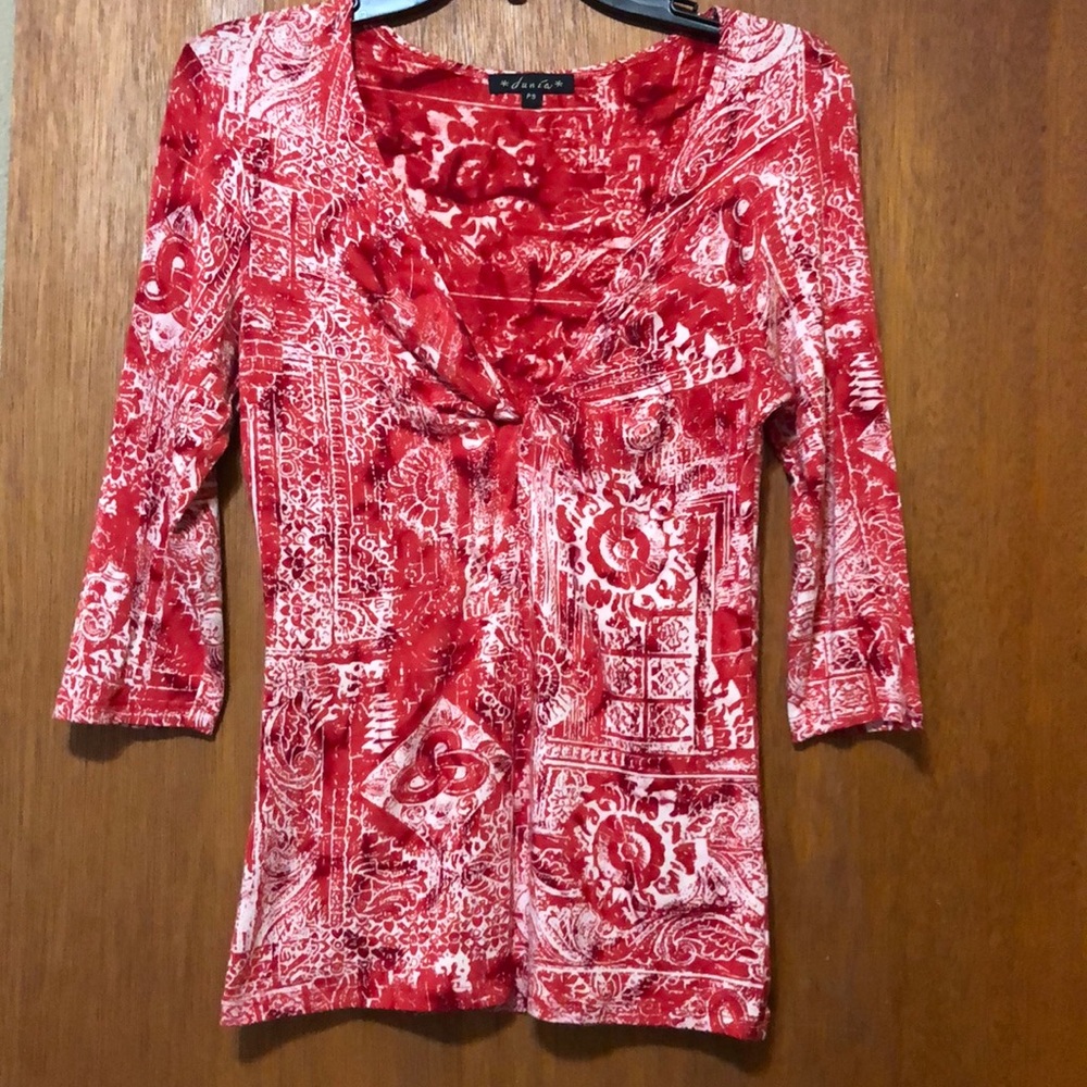 Fun colorful top. No wrinkle. Very soft.